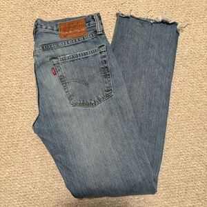 Levi's Faded Blue Denim Jeans with frayed bottom edge 31" waist